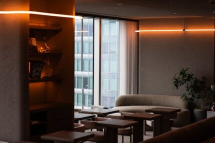 Stylish modern lounge interior with ambient warm lighting and sleek furniture in Tokyo.